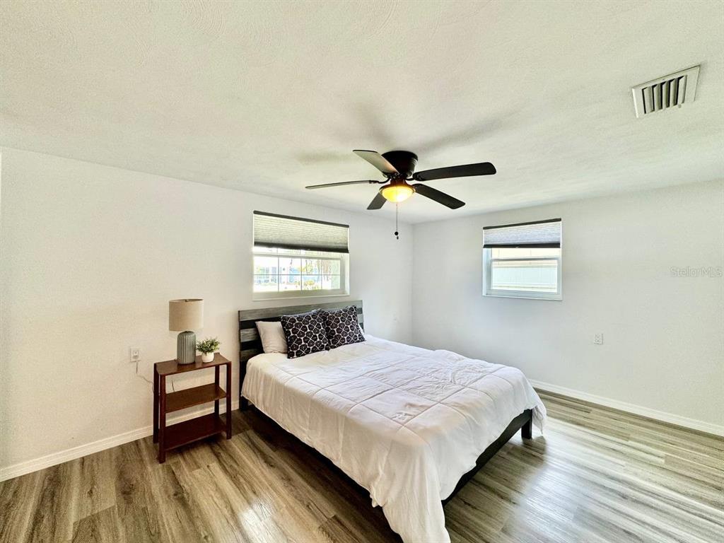 4282 Rudder Way New Port Richey, FL 34652 - Photo 13 of 34 a bedroom with a bed and a window