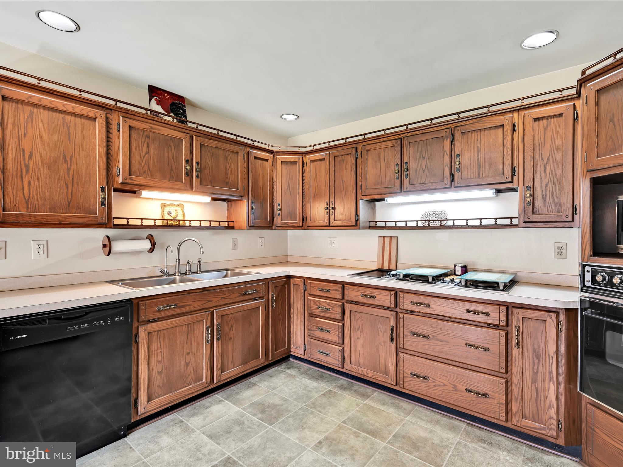 600 Beech Street Reading, PA 19605 - Photo 15 of 50 a kitchen with stainless steel appliances granite countertop a sink a stove and cabinets