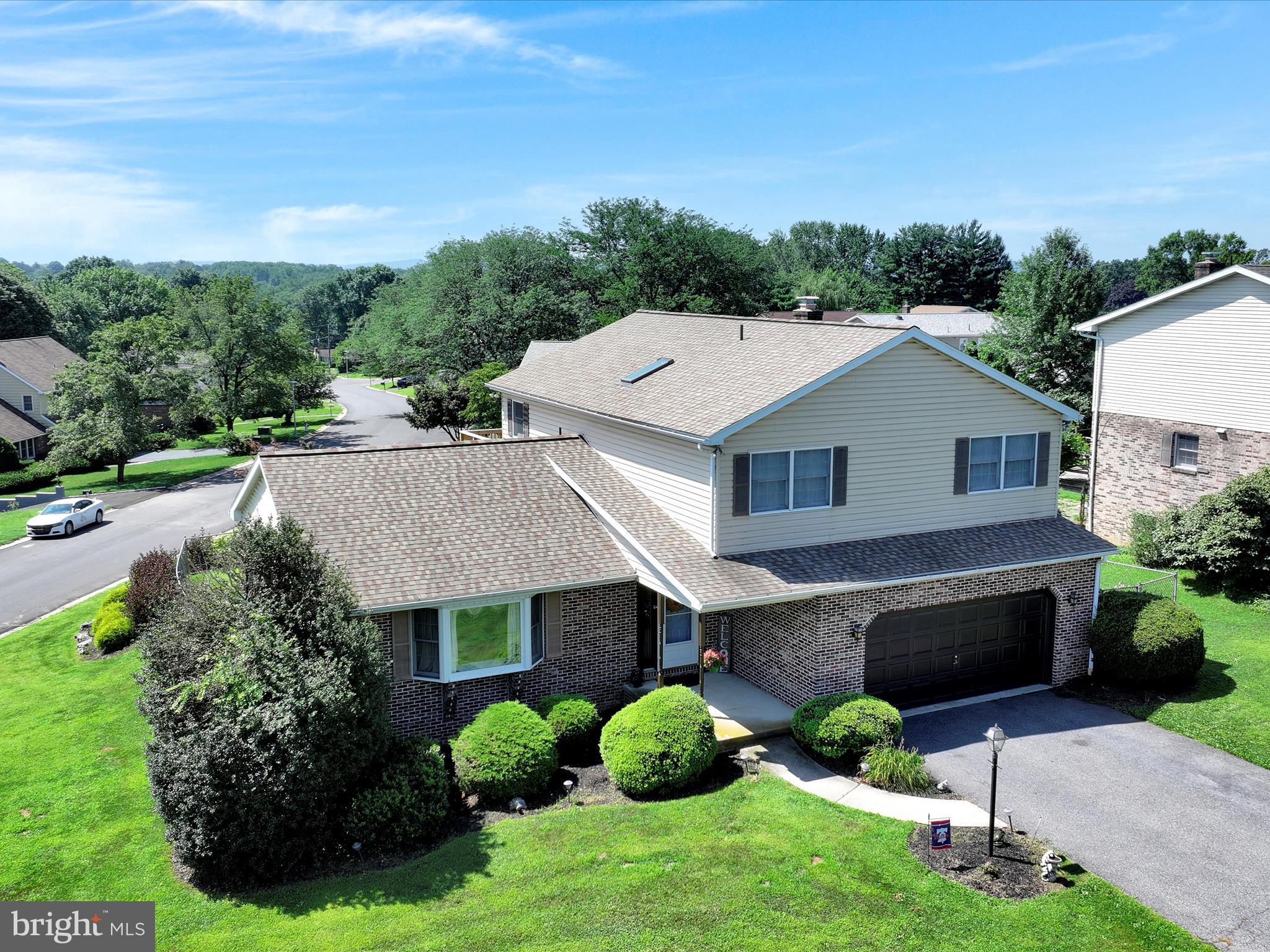 600 Beech Street Reading, PA 19605 - Photo 2 of 50 a aerial view of a house with table and chairs plants and large tree