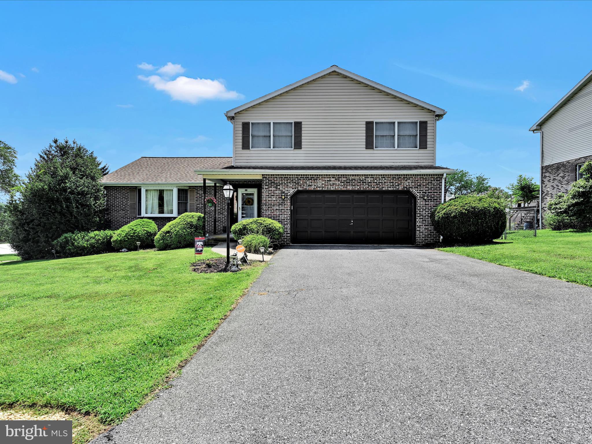 600 Beech Street Reading, PA 19605 - Photo 3 of 50 a front view of a house with a yard and garage