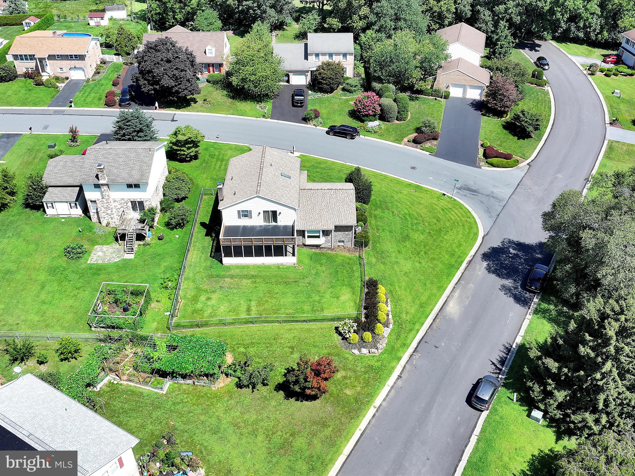 600 Beech Street Reading, PA 19605 - Photo 44 of 50 an aerial view of a house with a garden and lake view
