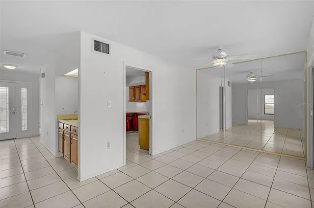 a view of a hallway with bathroom