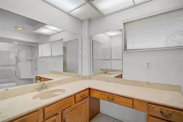 a kitchen with a sink and a refrigerator