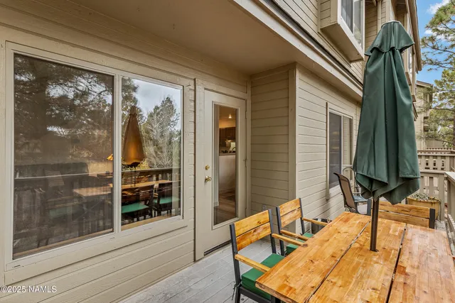 a view of two chairs in the balcony