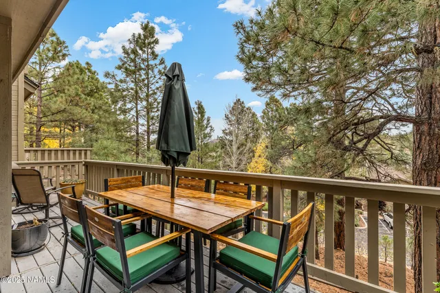 a view of a balcony with chairs