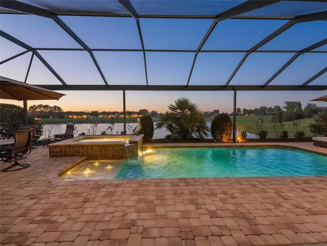 a view of a swimming pool with a patio