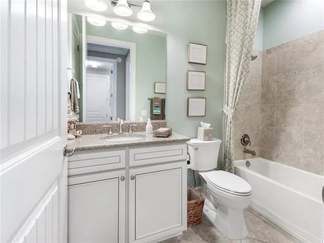 a spacious bathroom with a double vanity sink shower and a mirror