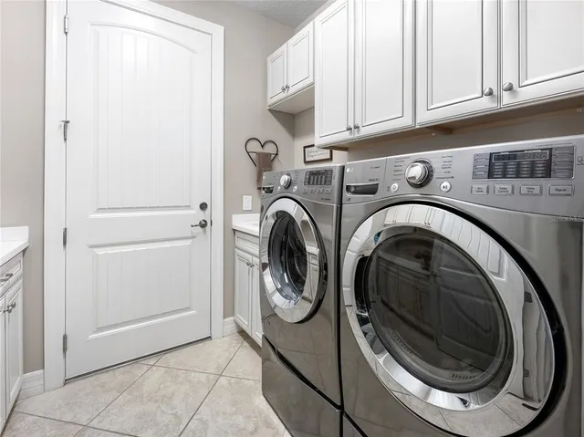 a bathroom with a glass shower door and a sink