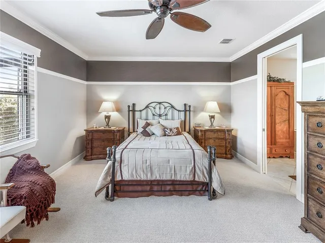a kitchen with stainless steel appliances kitchen island granite countertop a sink and cabinets