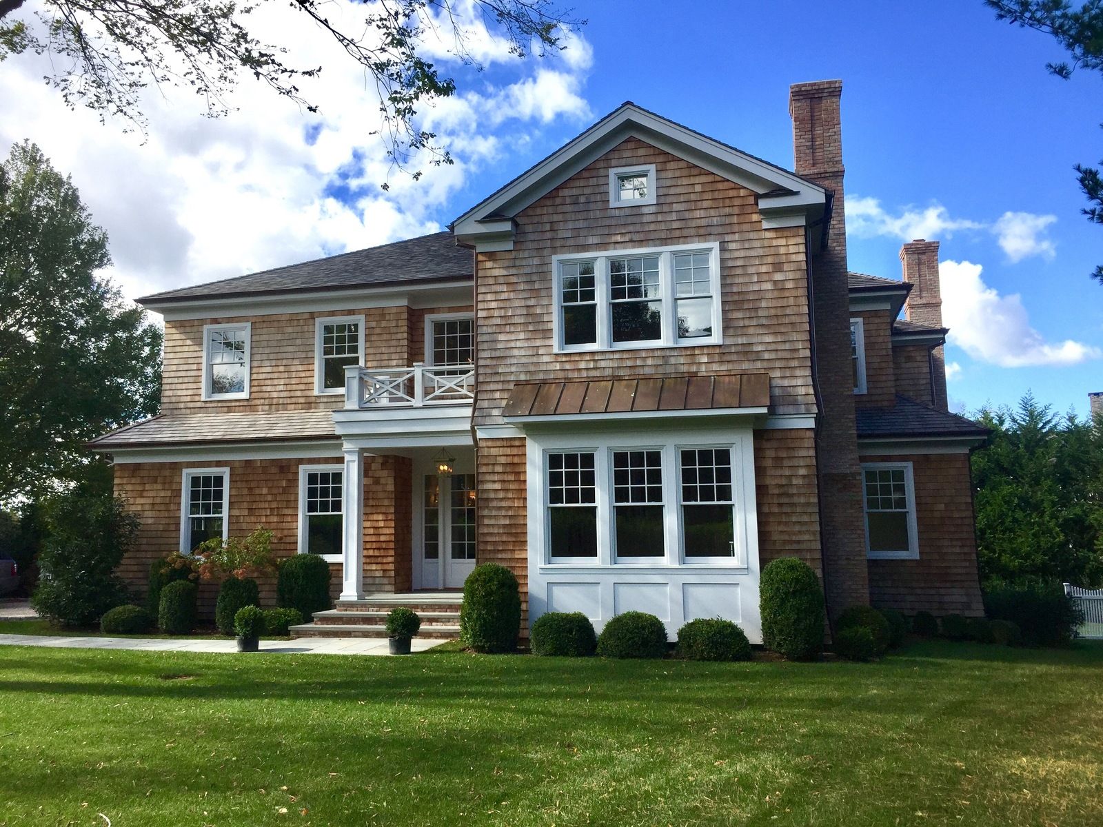 Undisclosed Address Water Mill, NY 11976 - Photo 15 of 16 a front view of a house with a yard