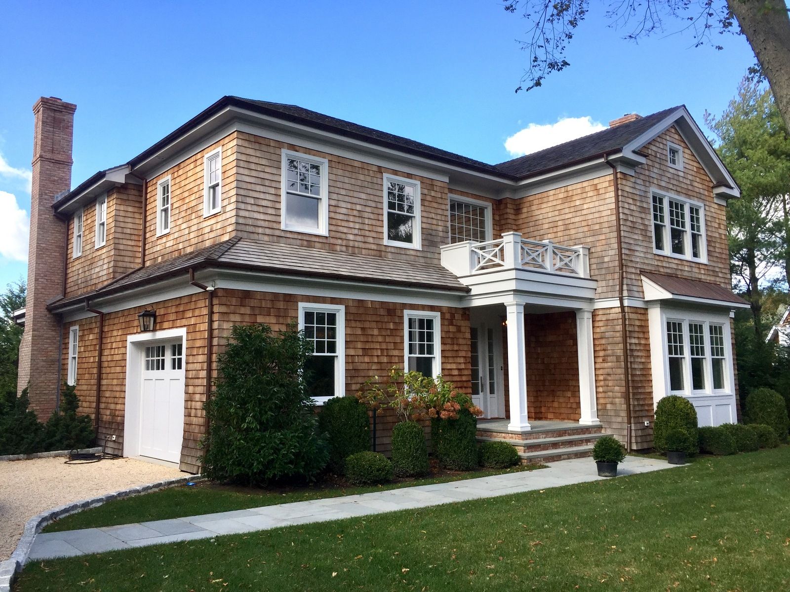 Undisclosed Address Water Mill, NY 11976 - Photo 16 of 16 a front view of a house with a yard