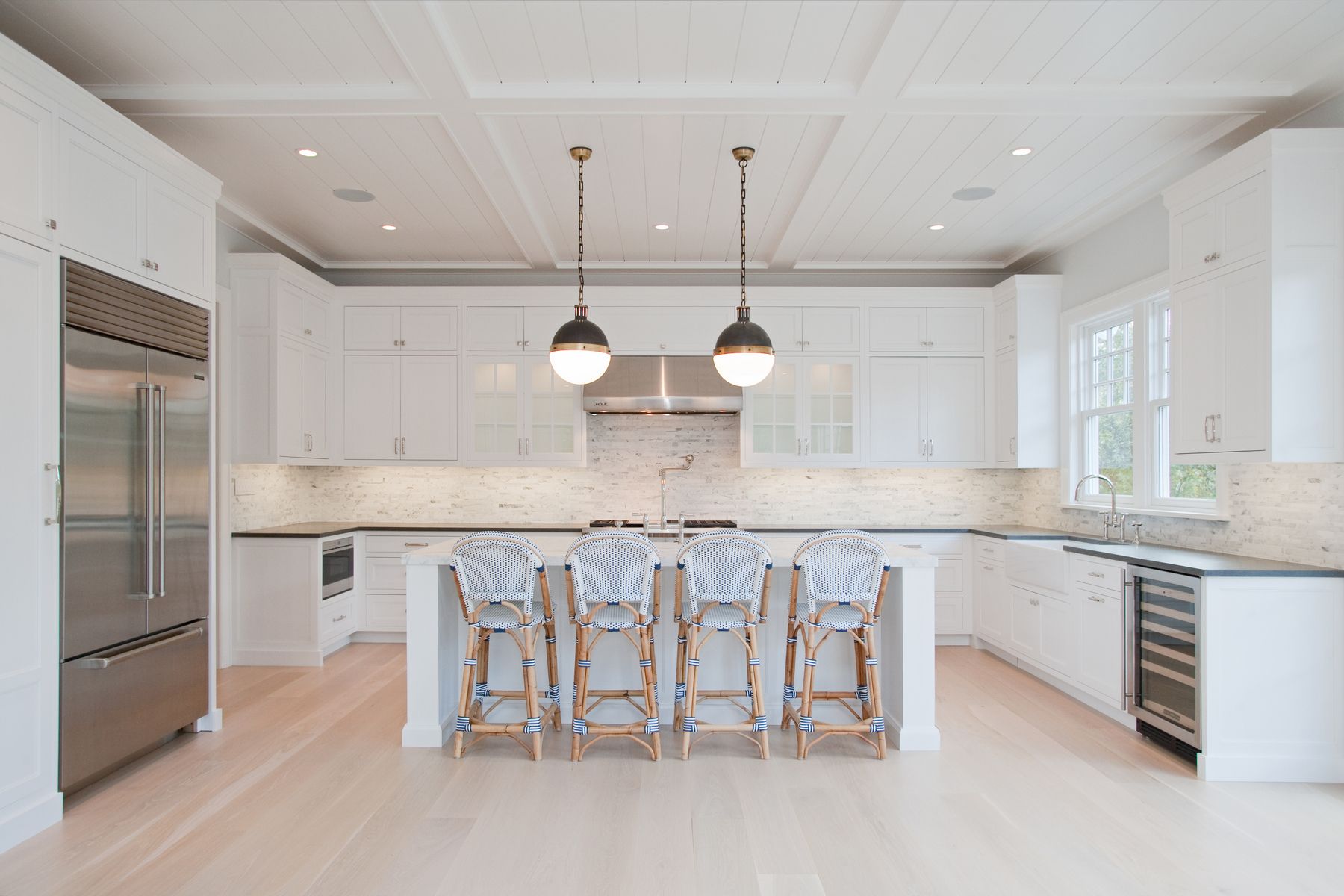Undisclosed Address Water Mill, NY 11976 - Photo 4 of 16 a large kitchen with a table and chairs in it
