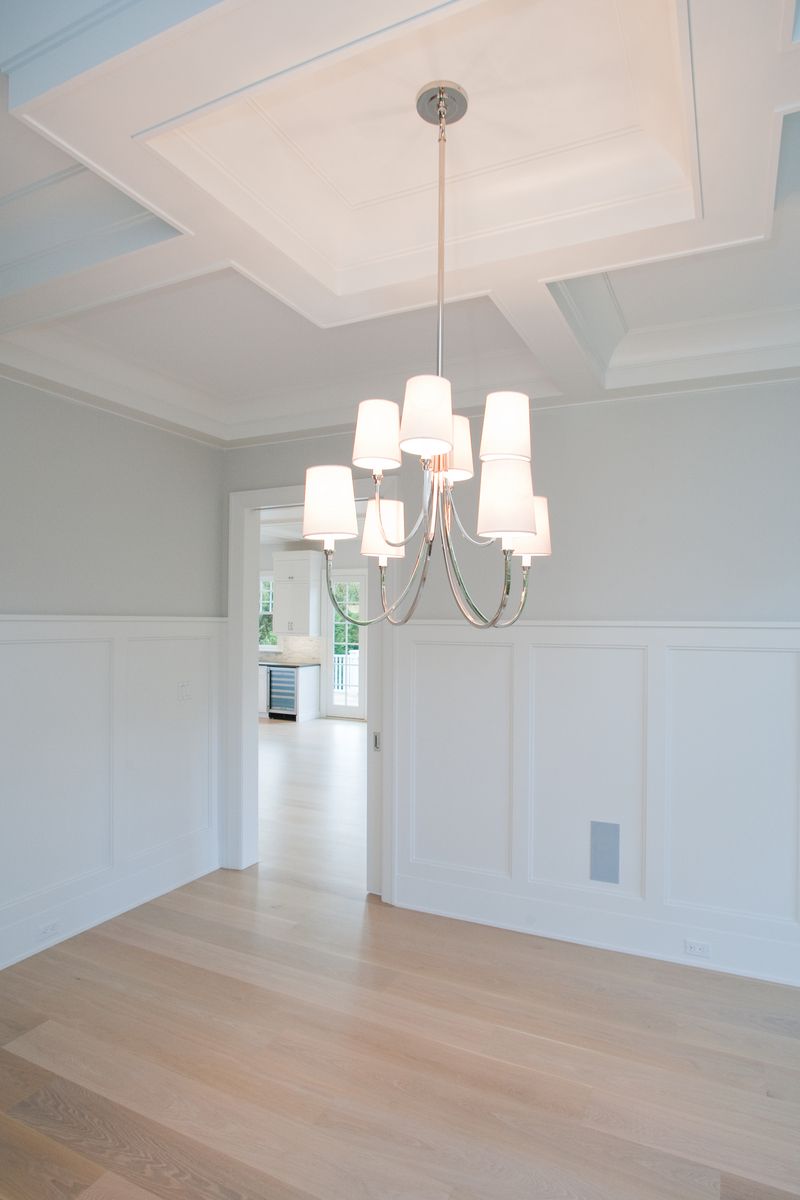 Undisclosed Address Water Mill, NY 11976 - Photo 5 of 16 a view of a room with a chandelier fan and glass door