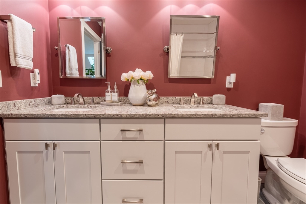 38 Cherry Street, Unit B Hudson, MA 01749 - Photo 30 of 33 a bathroom with a sink vanity and a mirror