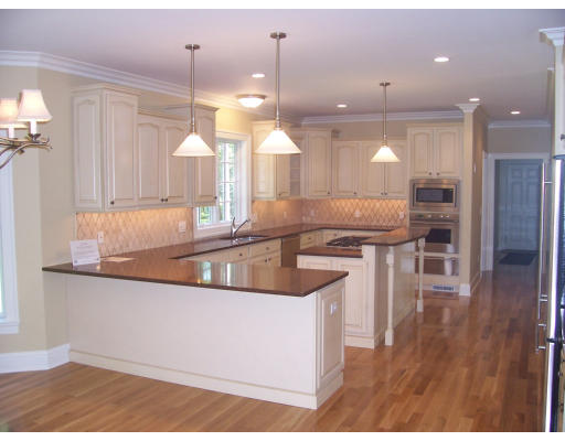 28 Wayside Inn Road Framingham, MA 01701 - Photo 6 of 20 a kitchen with stainless steel appliances granite countertop a sink a oven a counter space and cabinets