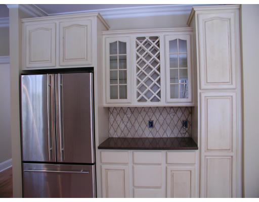 28 Wayside Inn Road Framingham, MA 01701 - Photo 8 of 20 a view of kitchen with white cabinets