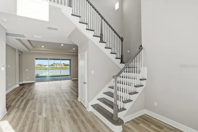 a view of entryway with wooden floor