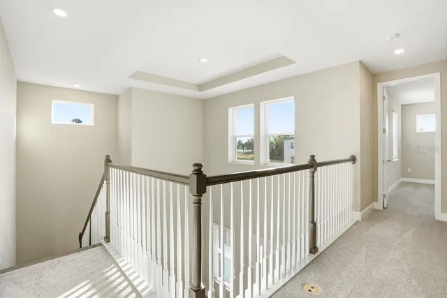 a view of a hallway with a window