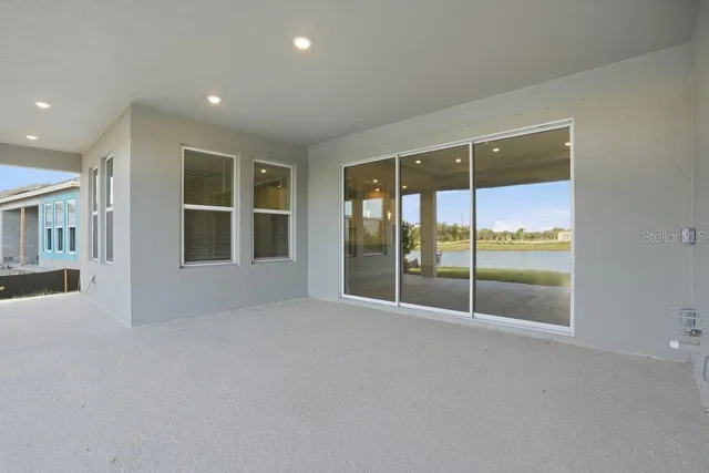 en empty room with sliding glass door and glass door
