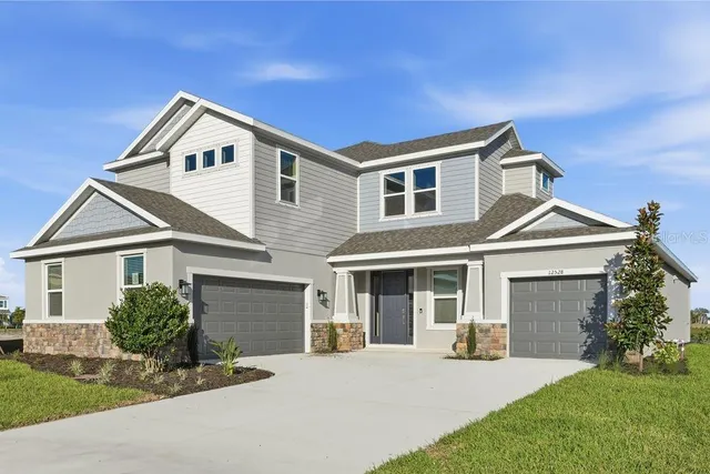 a front view of a house with a yard and porch