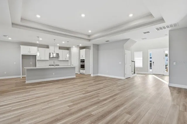 a view of kitchen view wooden floor and window