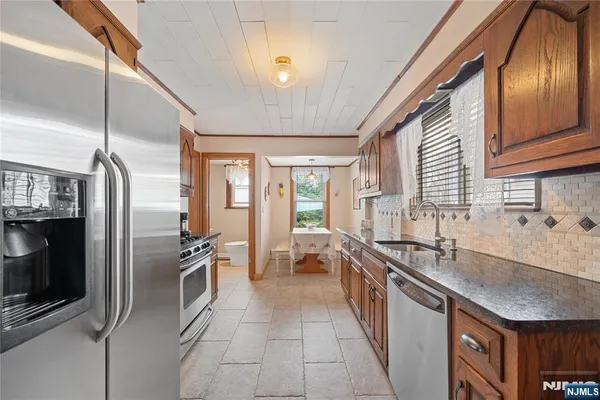 a bedroom with a bed ceiling fan and a window