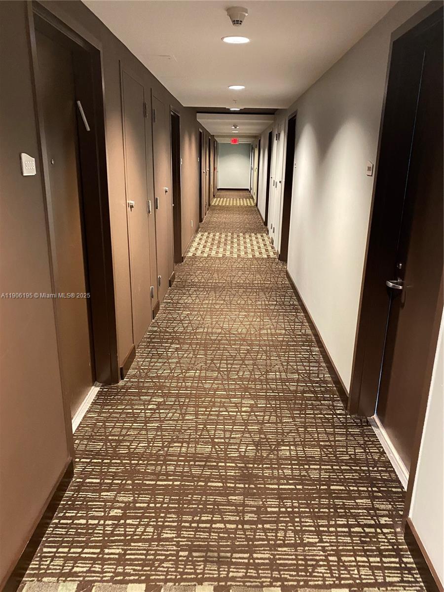 60 Southwest 13th Street, Unit 3003 Miami, FL 33130 - Photo 14 of 17 a view of hallway with stairs