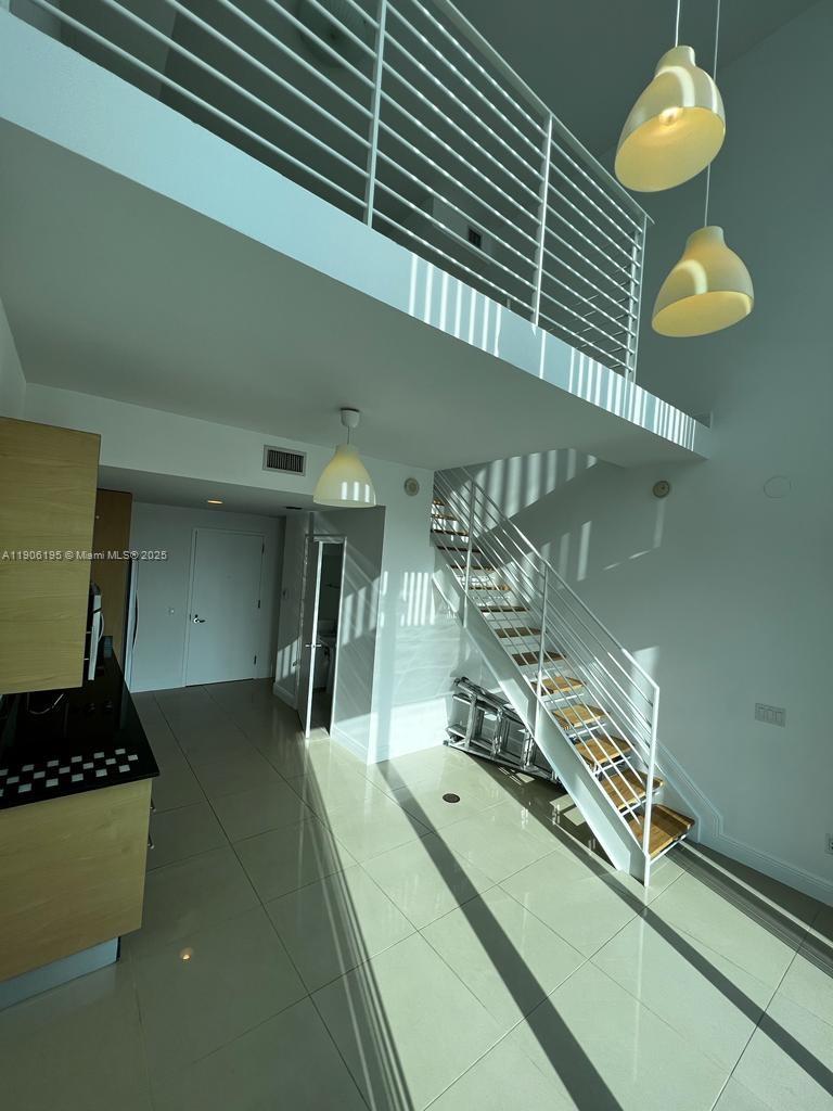 60 Southwest 13th Street, Unit 3003 Miami, FL 33130 - Photo 9 of 17 a room with gym equipment