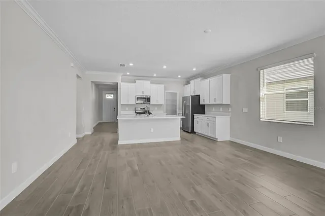a view of kitchen with wooden floor
