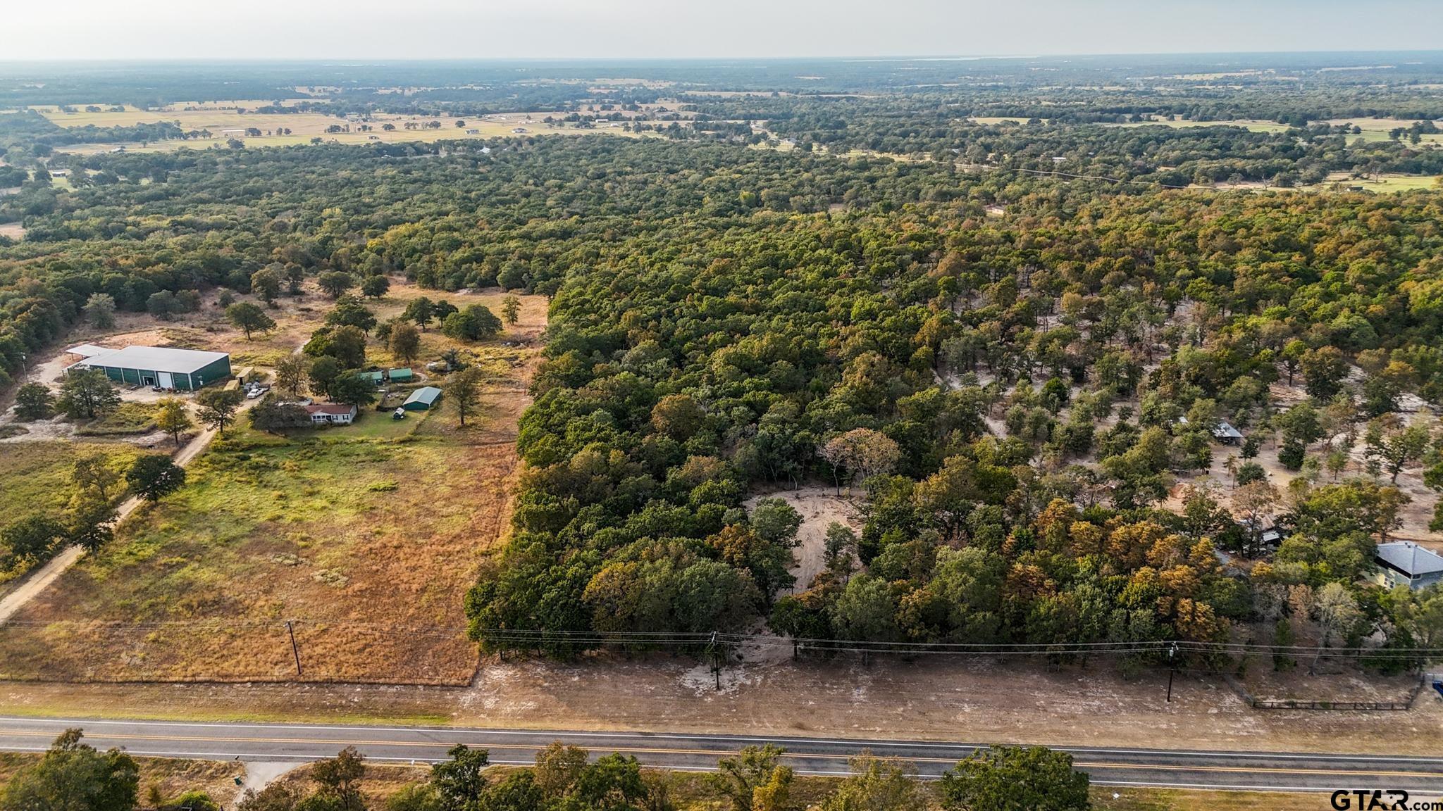 59 Athens Tx 75751 Athens, TX 75751 - Photo 5 of 10 an aerial view of residential houses with outdoor space and trees