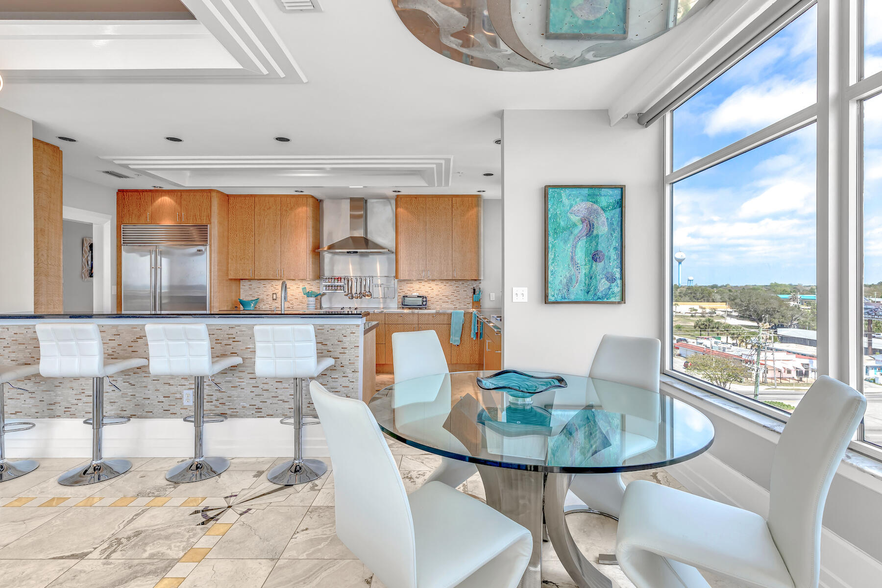 508 Harbor Boulevard, Unit 501 Destin, FL 32541 - Photo 11 of 47 a dining room with a table and chairs