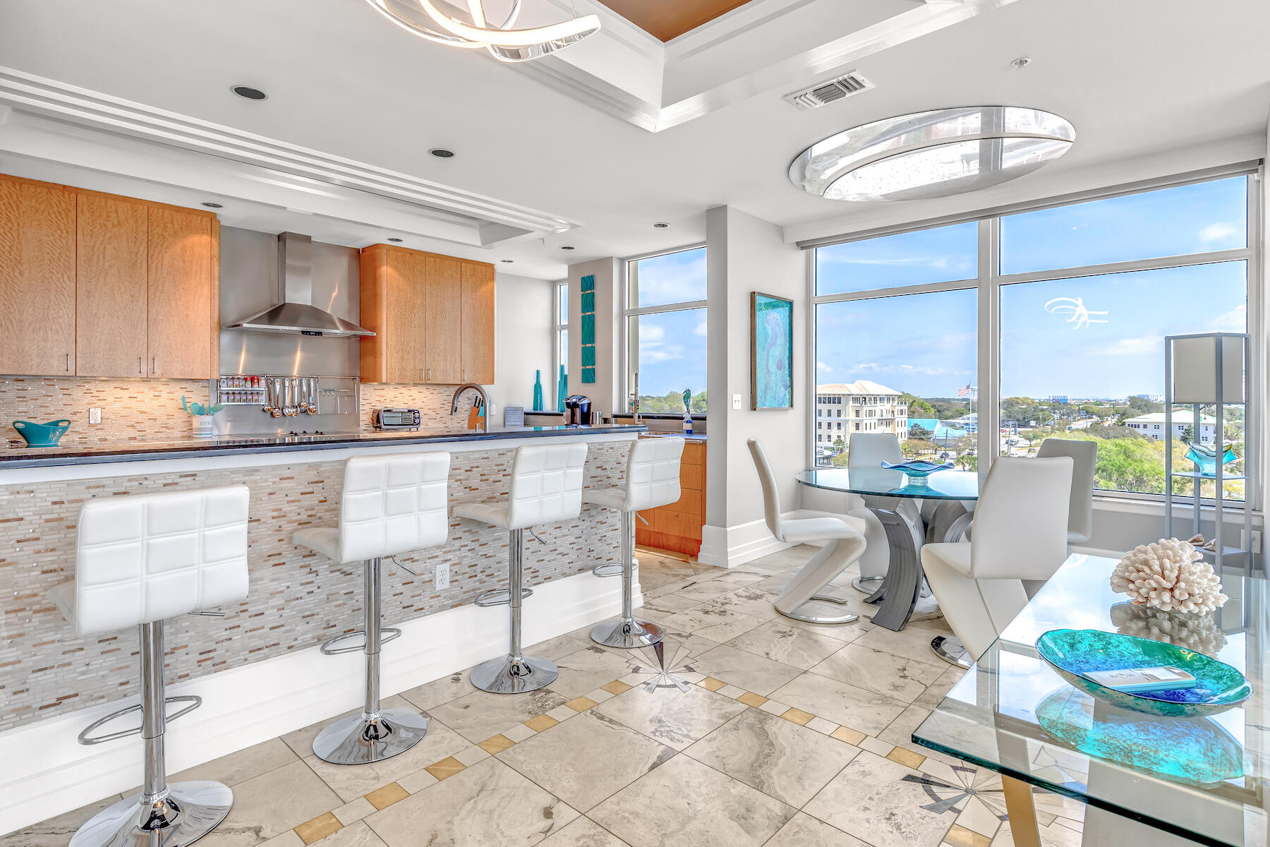 508 Harbor Boulevard, Unit 501 Destin, FL 32541 - Photo 12 of 47 a dining table chairs and a kitchen view