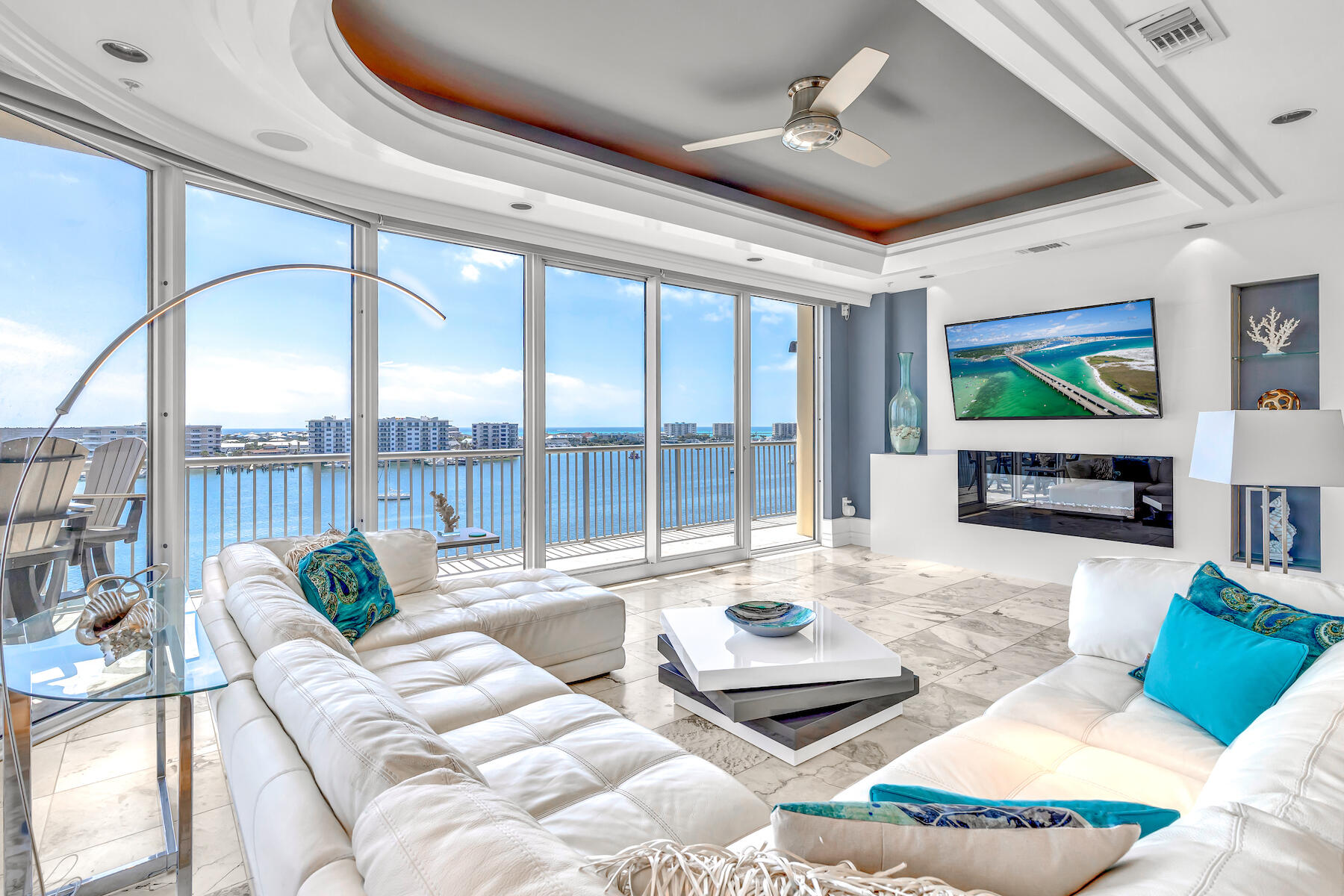 508 Harbor Boulevard, Unit 501 Destin, FL 32541 - Photo 2 of 47 a living room with furniture large window and flat screen tv