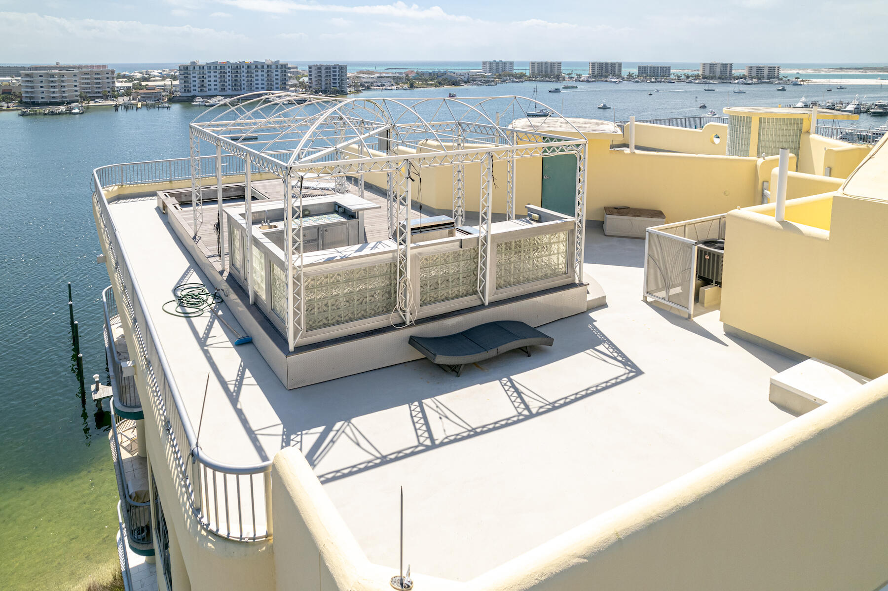 508 Harbor Boulevard, Unit 501 Destin, FL 32541 - Photo 30 of 47 a view of a terrace with wooden floor and seating space