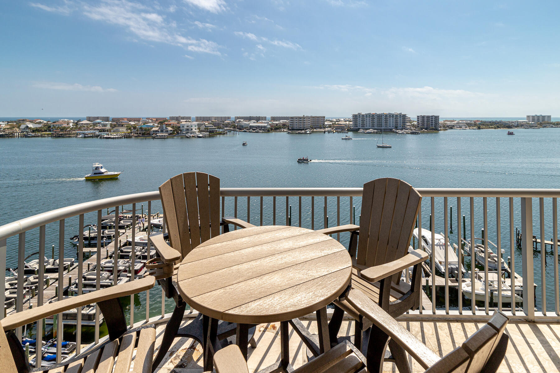 508 Harbor Boulevard, Unit 501 Destin, FL 32541 - Photo 6 of 47 a view of a roof deck with chair and wooden floor
