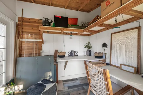 a kitchen with stainless steel appliances kitchen island granite countertop a refrigerator and a stove