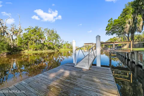 a view of a slide with floor to ceiling windows with wooden floor