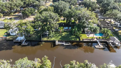 a view of a lake with lawn chairs