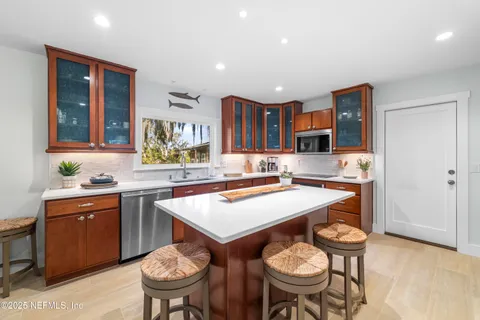 a kitchen with a table and chairs in it