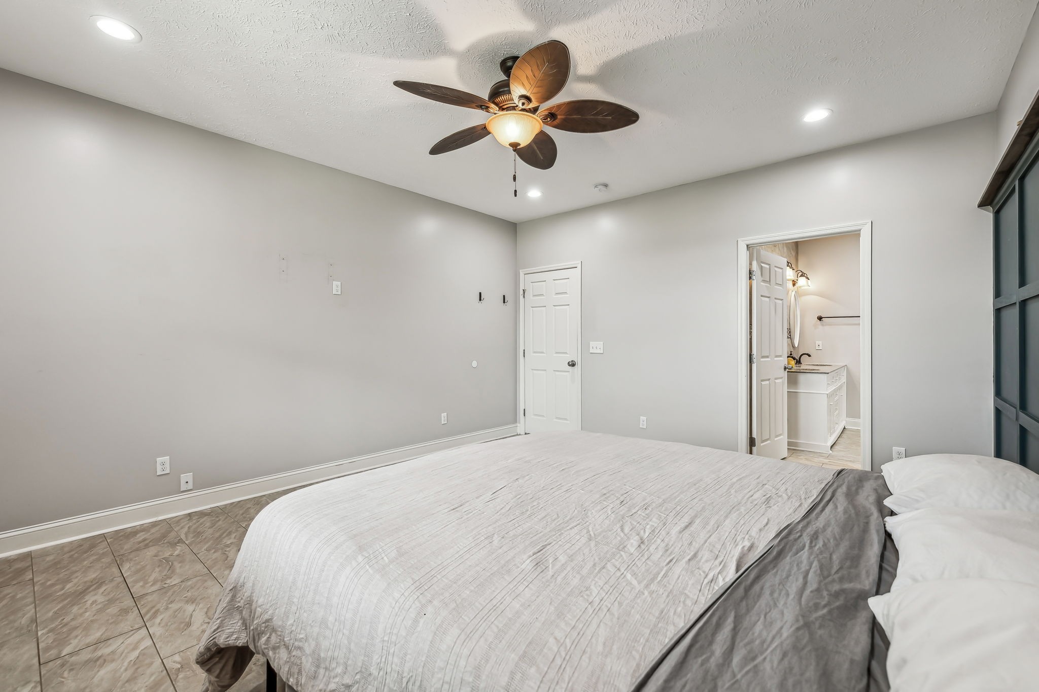 4618 Simmons Bluff Road Lebanon, TN 37090 - Photo 11 of 35 a bedroom with a bed and a ceiling fan