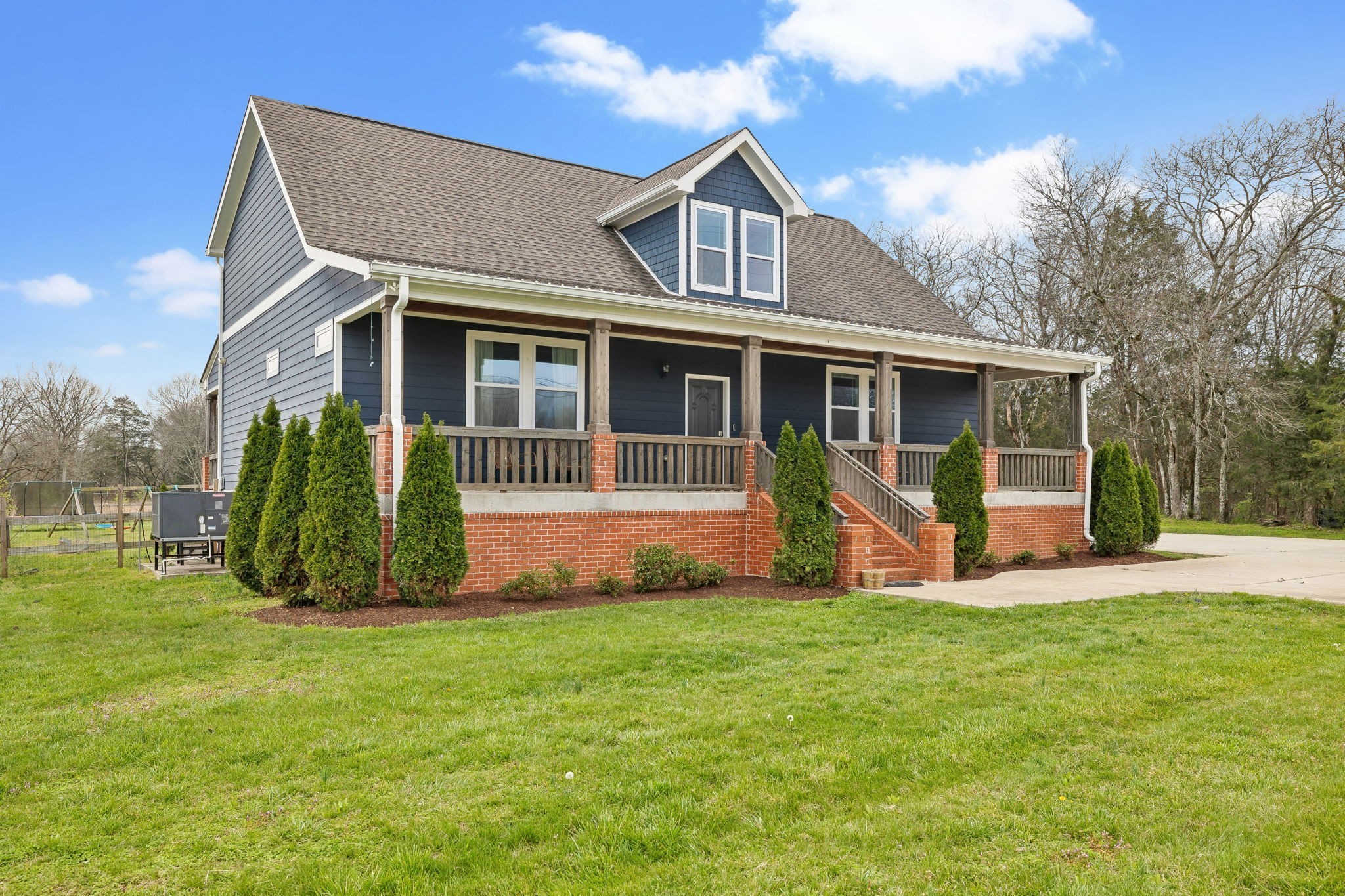 4618 Simmons Bluff Road Lebanon, TN 37090 - Photo 2 of 35 a view of a house with a yard and plants