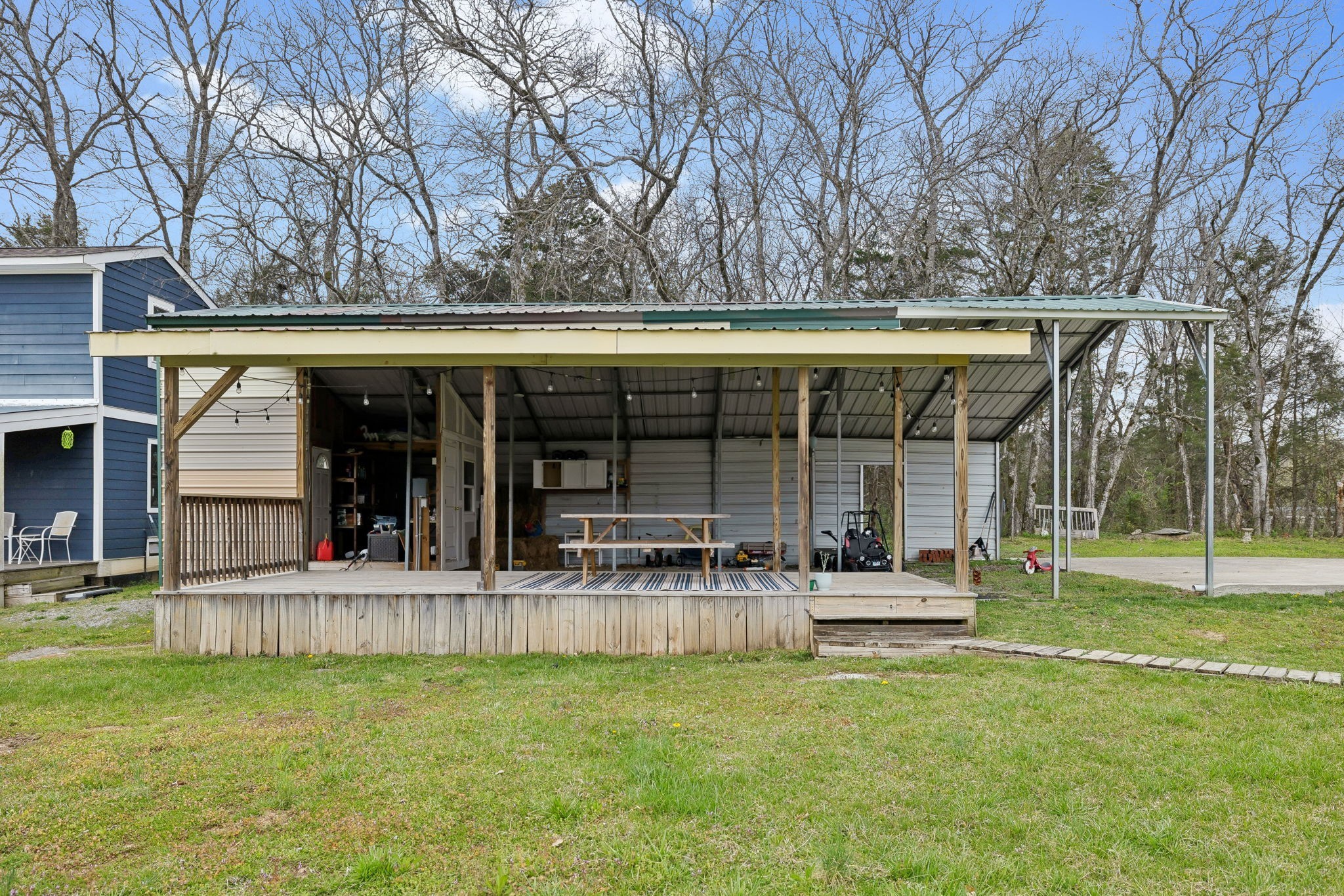 4618 Simmons Bluff Road Lebanon, TN 37090 - Photo 32 of 35 a view of a house with a yard and sitting area