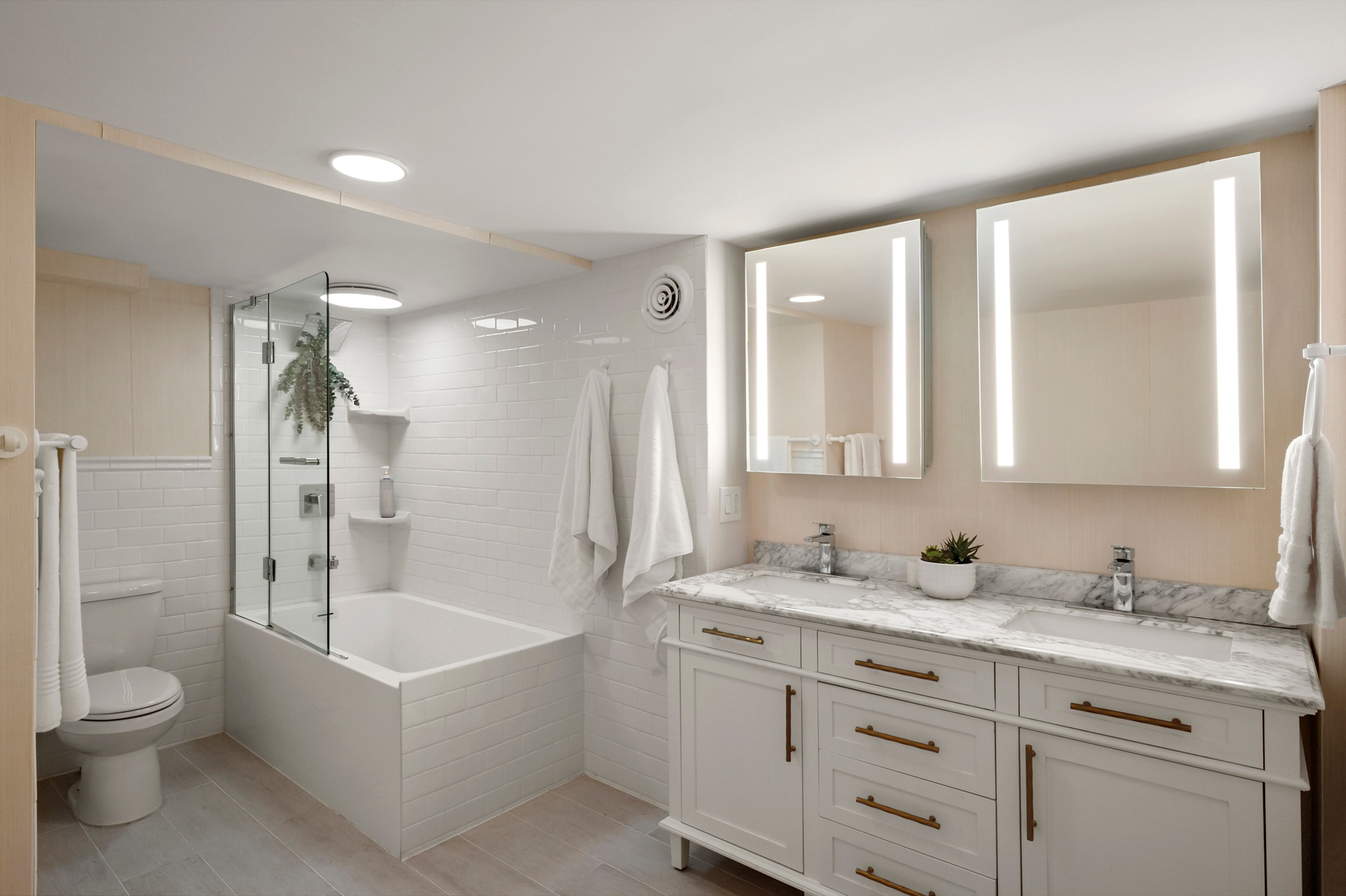 237 East 88th Street, Unit 101 Manhattan, NY 10128 - Photo 9 of 17 a bathroom with a granite countertop sink a toilet mirror and bathtub