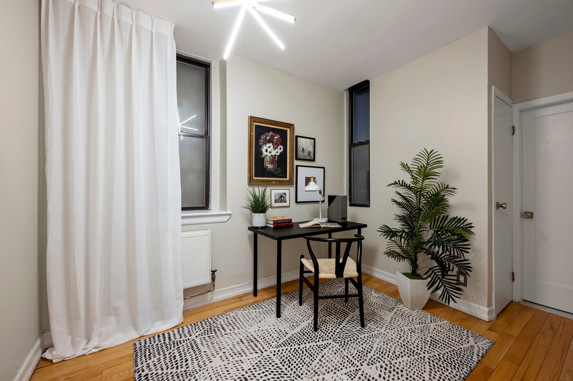 237 East 88th Street, Unit 101 Manhattan, NY 10128 - Photo 13 of 17 a workspace with furniture and wooden floor
