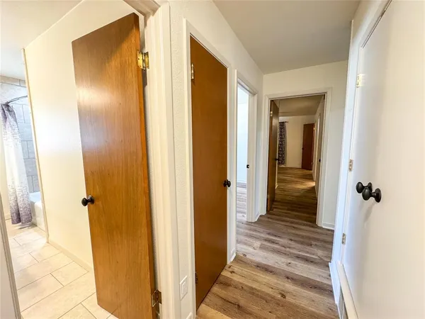 a view of a bathroom from a hallway