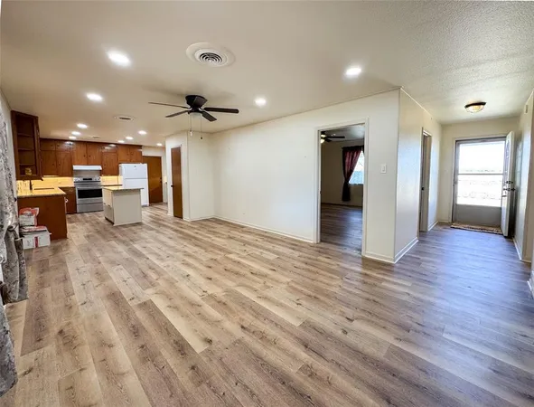a view of a kitchen and dining room