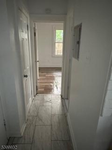 231 Alexander Street, Unit 1R Newark, NJ 07106 - Photo 6 of 9 a view of room with window and hardwood