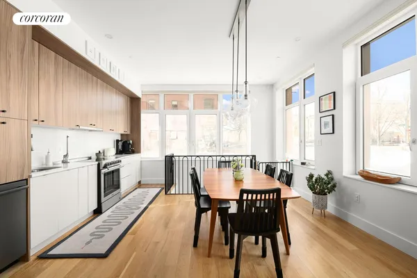 a view of a dining room with furniture window and wooden floor