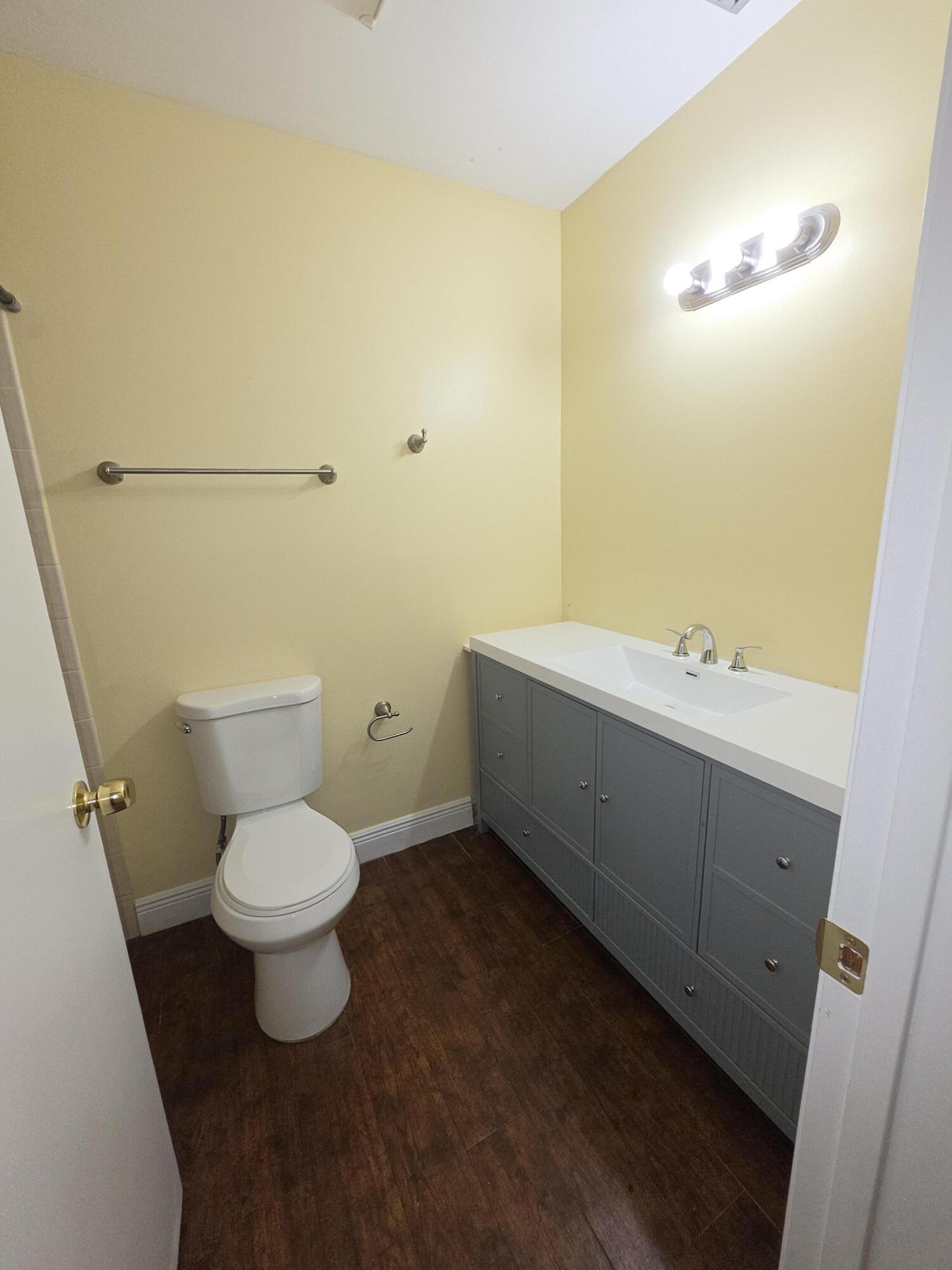 401 Springdale Circle Palm Springs, FL 33461 - Photo 13 of 31 a bathroom with a sink and a toilet