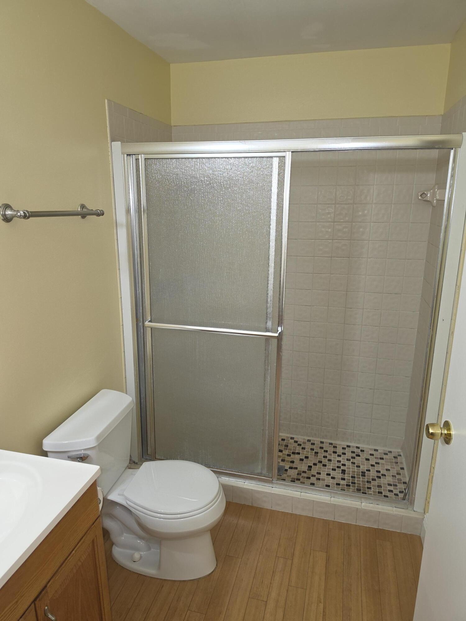 401 Springdale Circle Palm Springs, FL 33461 - Photo 22 of 31 a bathroom with a shower and a toilet